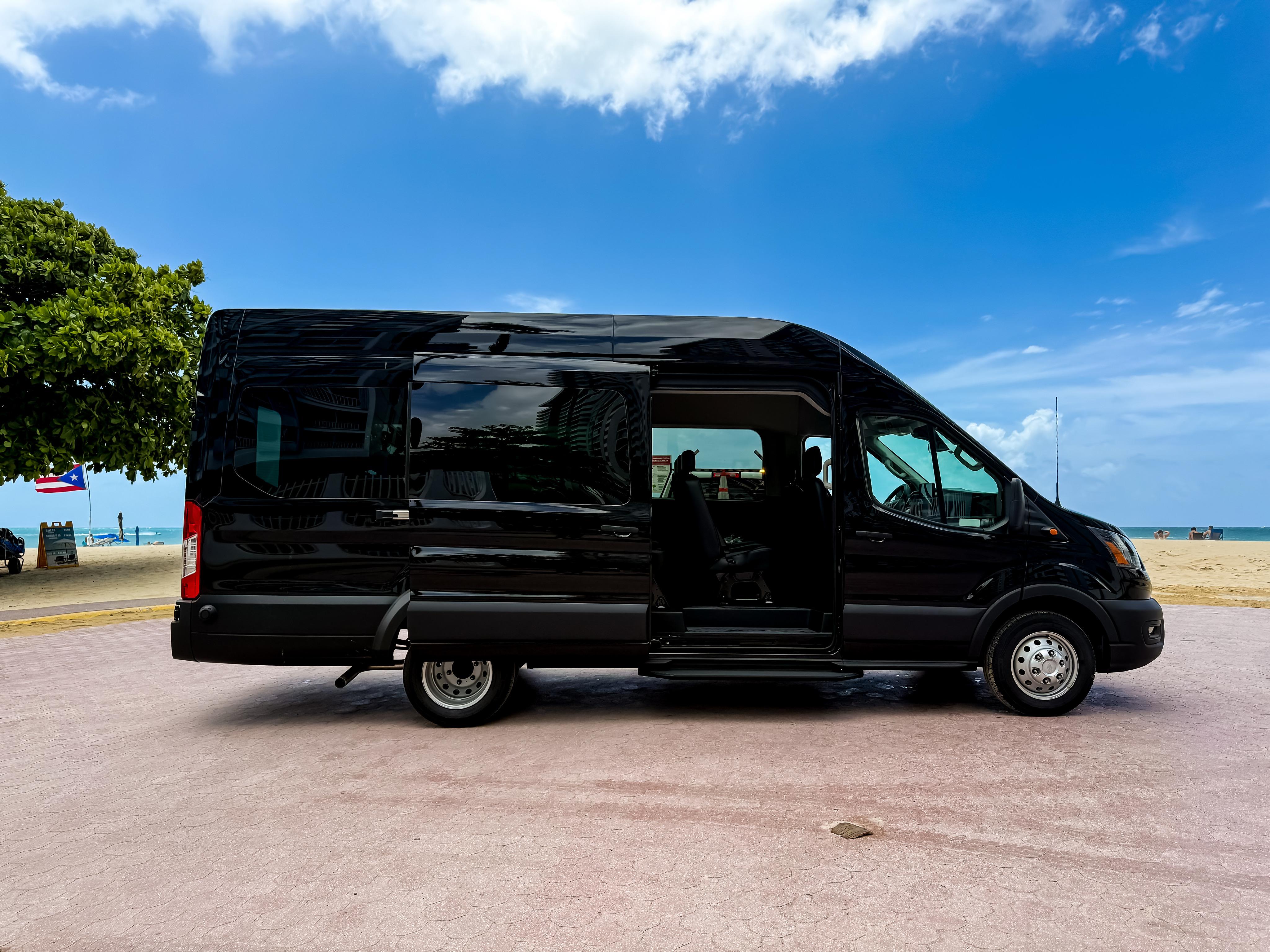 Two Ford Transit high-roof vans in the Premier Transportation fleet